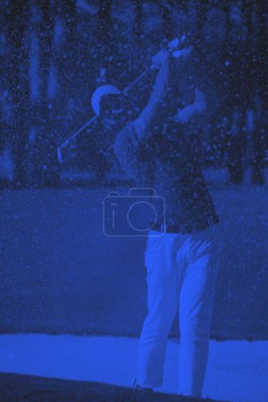 Photo for Golfer hitting a sand bunker shot - Royalty Free Image