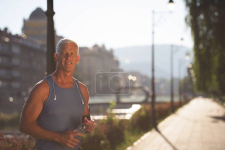 Photo for Portrait of handsome senior jogging man - Royalty Free Image