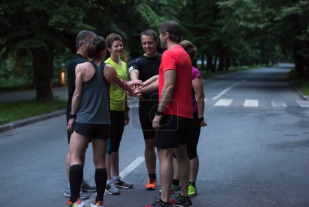 Photo for Runners giving high five to each other - Royalty Free Image