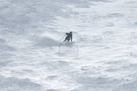 Photo for "winter sport. man skiing in mountains - Royalty Free Image
