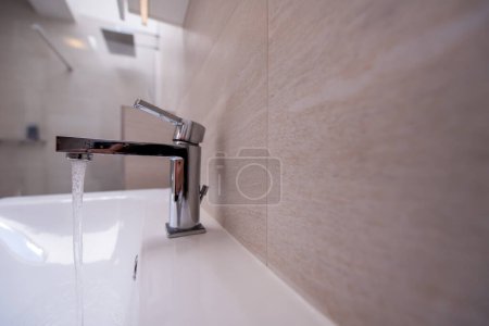 Photo for Open Water Faucet in bath - Royalty Free Image