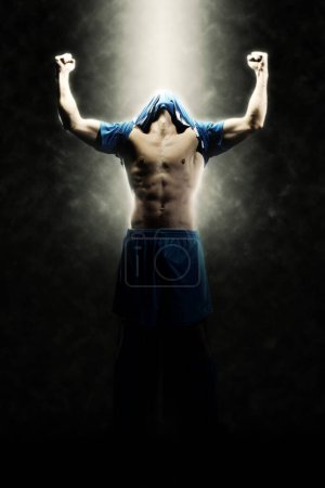 Photo for Soccer player on dark background - Royalty Free Image