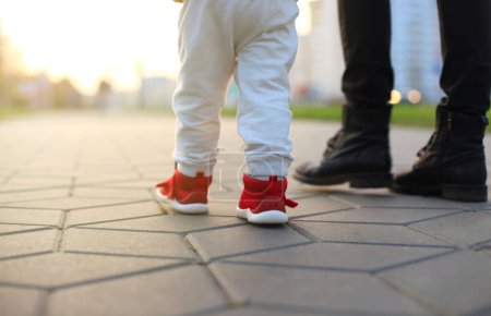 Photo for Baby's first steps. The first independent steps. - Royalty Free Image
