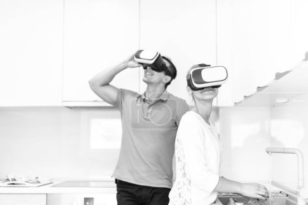 Photo for Young couple using VR-headset glasses of virtual reality - Royalty Free Image