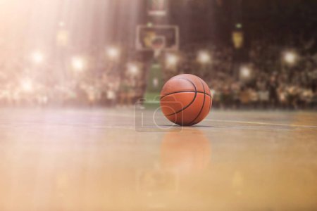 Photo for Basketball ball in front of big modern basketball arena - Royalty Free Image