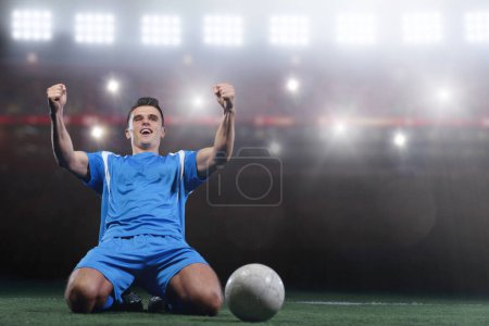 Téléchargez les photos : Joueur de football en face du grand stade moderne avec des fusées éclairantes et des lumières - en image libre de droit