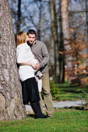 Photo for Couple posing outdoors, happy pregnancy concept - Royalty Free Image