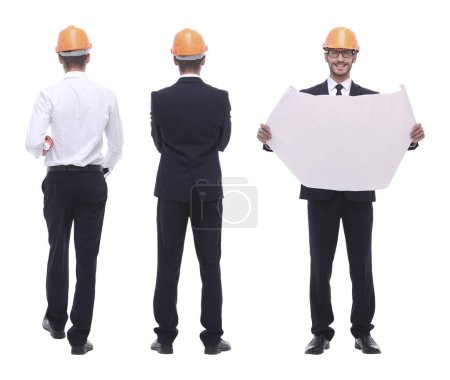 Photo for In full growth .a qualified architect in an orange helmet - Royalty Free Image