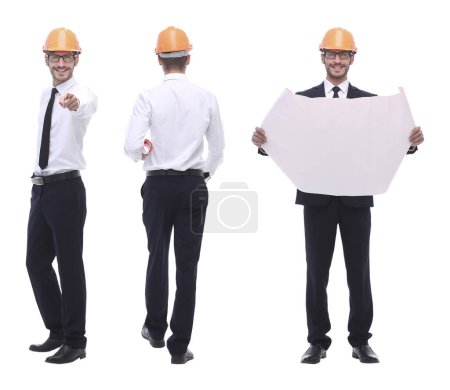 Photo for In full growth .a qualified architect in an orange helmet - Royalty Free Image