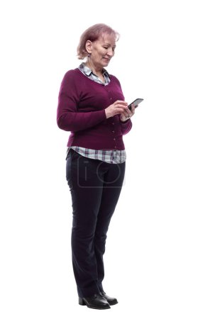 Photo for Cute elderly woman reading a message on her smartphone . isolated - Royalty Free Image