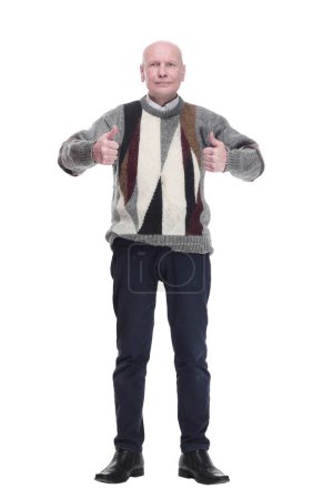Photo for Satisfied man in a warm sweater showing thumbs up. isolated - Royalty Free Image