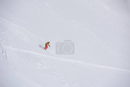 Photo for Freeride skier skiing in deep powder snow - Royalty Free Image