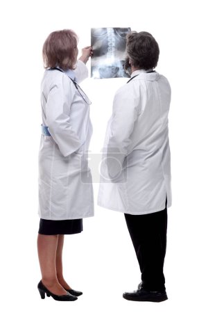 Photo for Medical colleagues looking at an x-ray . isolated on a white - Royalty Free Image