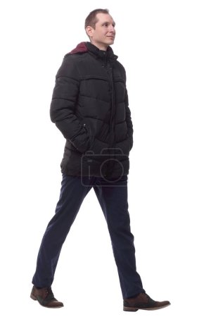 Photo for Casual young man in autumn jacket striding forward. - Royalty Free Image