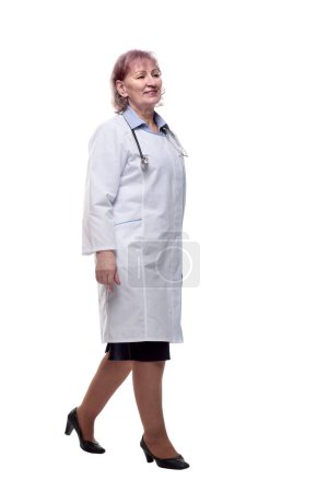 Photo for Smiling woman doctor striding forward . isolated on a white - Royalty Free Image