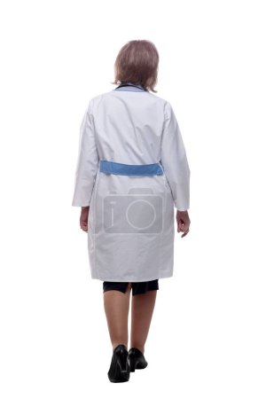 Photo for Rear view. a female doctor walks forward - Royalty Free Image