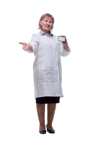 Foto de Qualified doctor with a visiting card showing a thumbs up. - Imagen libre de derechos