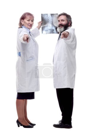 Photo for Medical colleagues looking at an x-ray . isolated on a white - Royalty Free Image