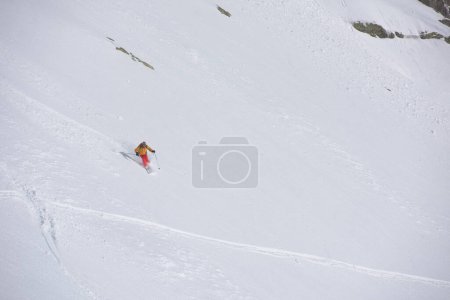 Photo for Freeride skier skiing in deep powder snow - Royalty Free Image