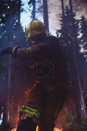 Photo for Portrait of firefighter in action - Royalty Free Image