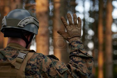 Photo for Officer is  showing tactical hand signals - Royalty Free Image
