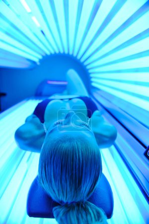 Photo for Woman receiving solarium treatment - Royalty Free Image