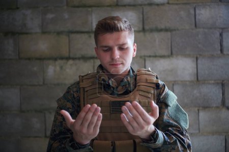 Photo for Portrait of muslim soldier praying - Royalty Free Image