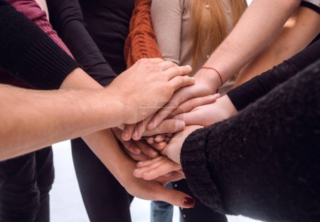 Photo for Group of diverse young people making a tower out of their hands - Royalty Free Image