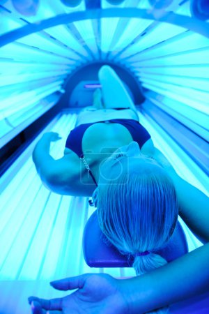 Photo for Woman receiving solarium treatment - Royalty Free Image