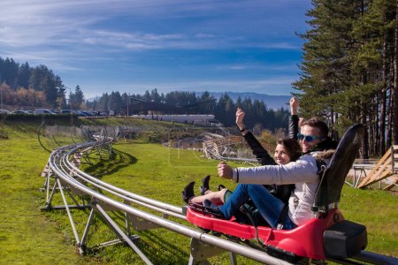couple driving on alpine coaster