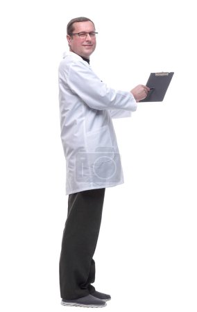 Photo for Doctor is pointing to a blank space in the clipboard. - Royalty Free Image