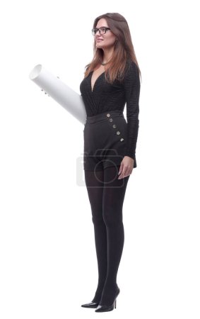 Foto de "side view. confident young woman with a roll of drawings looking" - Imagen libre de derechos