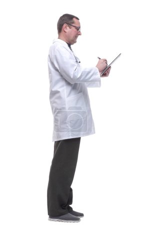 Photo for Doctor writes down his recommendations in the clipboard. - Royalty Free Image