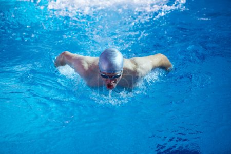 Photo for Swimmer exercise on indoor swimming pool - Royalty Free Image