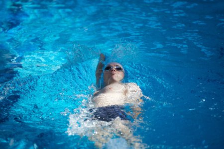 Photo for Swimmer exercise on indoor swimming pool - Royalty Free Image