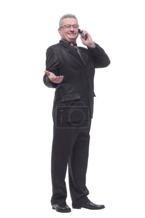 Photo for "Business man talking on the phone standing over white background" - Royalty Free Image