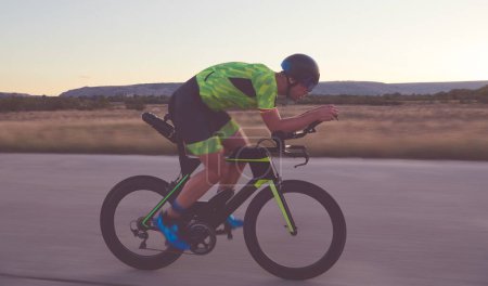 Photo for Triathlon athlete riding a  bike - Royalty Free Image