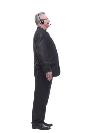 Téléchargez les photos : Side view of a business man with headphone looking ahead - en image libre de droit