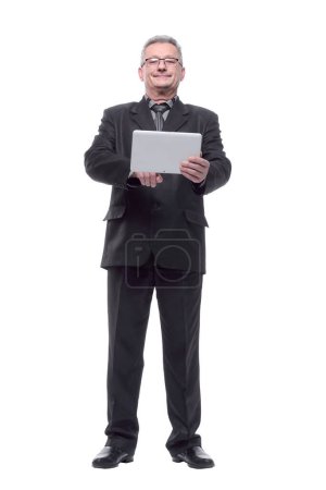 Photo for Senior man in suit and with glasses using tablet computer - Royalty Free Image