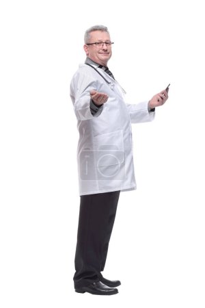 Photo for Side view of male doctor looking at smart phone screen with smile - Royalty Free Image