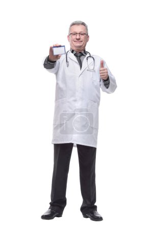 Photo for "Friendly medical doctor with blank mediical ID's card" - Royalty Free Image