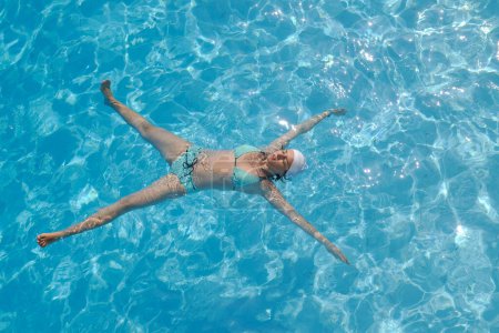 Photo for Woman relax at swimming pool - Royalty Free Image