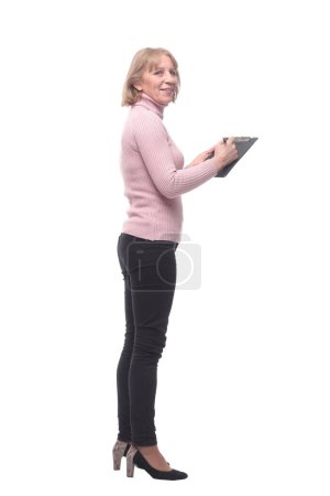 Photo for "Full length portrait of smiling business woman pointing on blank clipboard" - Royalty Free Image