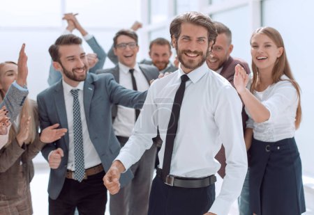Photo for Happy group of employees congratulating their leader - Royalty Free Image