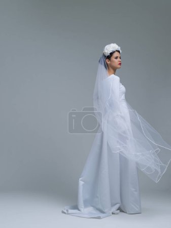 Photo for Young bride in a wedding dress with a veil - Royalty Free Image