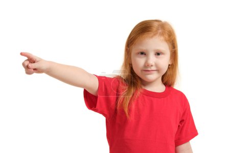 Photo for Education, school and imaginary screen concept - cute little girl pointing in the air or imaginary screen - Royalty Free Image