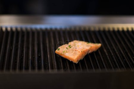 Photo for "Salmon fillets cooking on grill" - Royalty Free Image