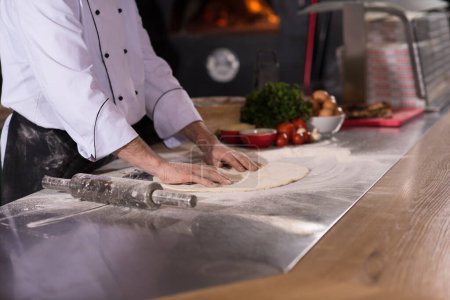 Photo for "chef preparing dough for pizza" - Royalty Free Image