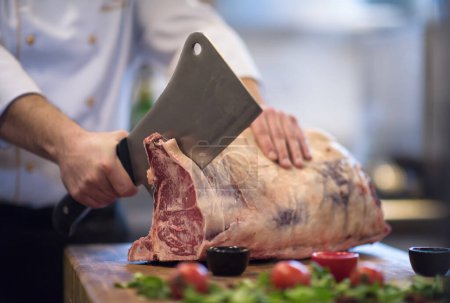 Photo for "chef cutting big piece of beef" - Royalty Free Image
