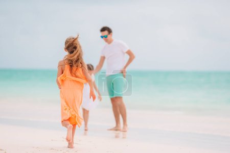 Photo for "Happy beautiful family on a tropical beach vacation" - Royalty Free Image